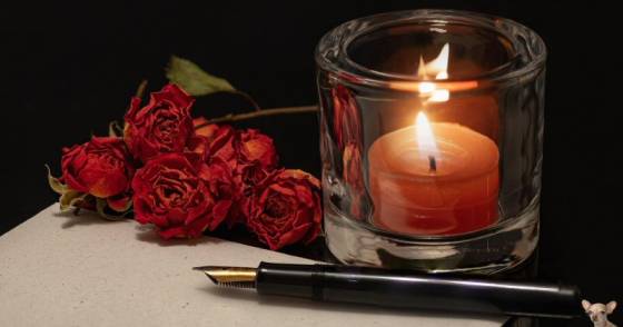 Red Candle, Roses, and Pen