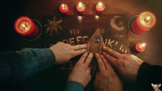 People Playing Ouija Board